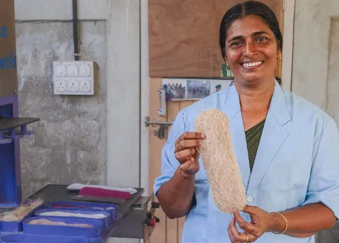 Banana fiber being molded and compressed into absorbent sheets