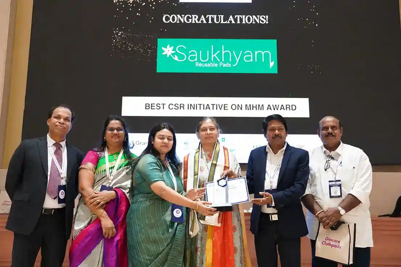 Saukhyam team receiving a CSR initiative award