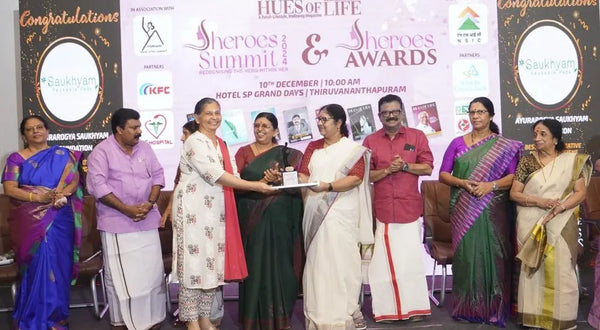 Women receiving recognition at an awards ceremony
